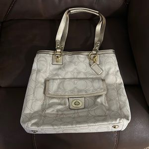 NWOT Coach Hampton turnlock. Never used.  No flaws